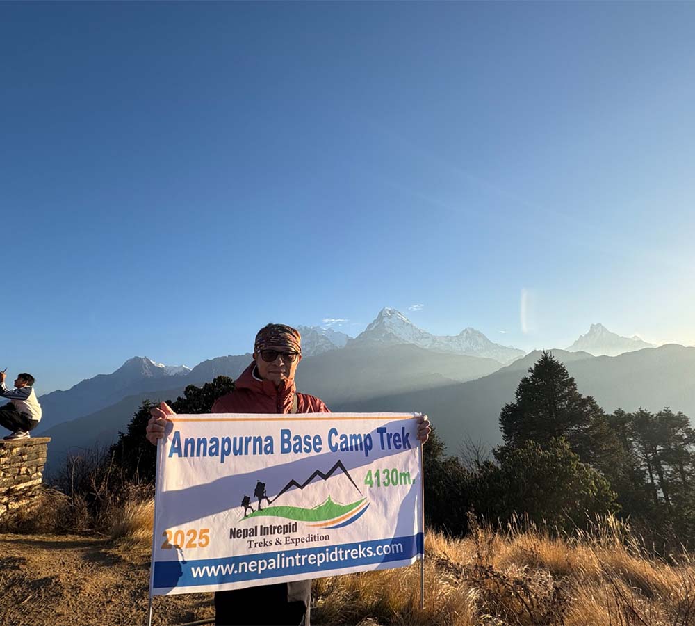 Man With Annapurna Base Camp Trek Banner